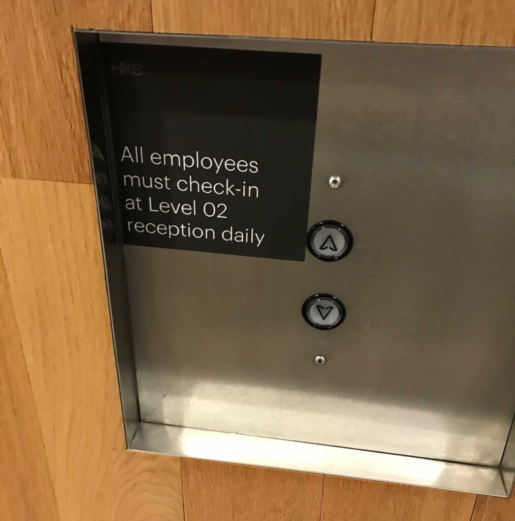 Decal sign next to elevator buttons